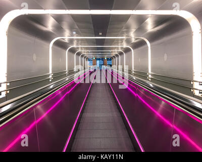 Neon escalator in Train Station Oslo Norway Stock Photo