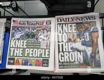 New York newspapers on Monday, September 25, 2017 report on the feud between some NFL players and US President Donald Trump over the players protesting during the national anthem by not standing and 'taking a knee'.  After Trump's remarks about firing the players over 200 team members protested at yesterdays games instead of the handful that previously 'took a knee'. (© Richard B. Levine) Stock Photo
