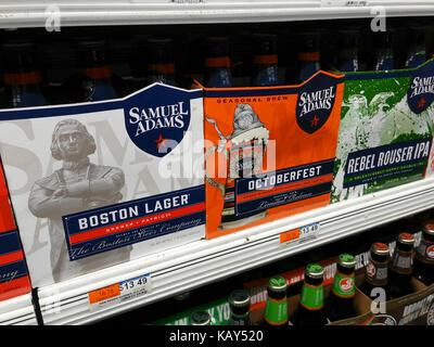 Six-packs of Samuel Adams beer are seen on a grocery store shelf in New York on Tuesday, September 26, 2017.  Boston Beer Co.,  the not quite micro-brewery brewer, has had its rating raised from underperform to neutral by Credit Suisse based on the fact that if it continues to perform poorly it is a takeover target by a larger brewery.. (© Richard B. Levine) Stock Photo