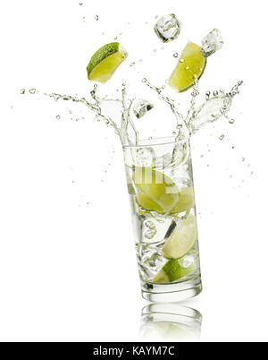glass full of water with lime slices and ice cubes falling and splashing water, on white background Stock Photo