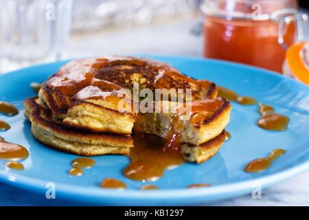 Close up on stack of homemade gluten free pancakes with peach jam Stock Photo