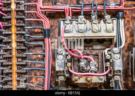 Old Rusted Electrical Panel with Fuses and Contacts in an Abandoned Automobile Factory IV Stock Photo