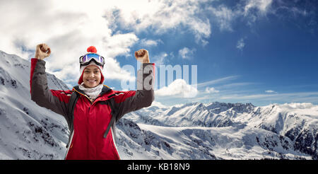 Happy woman in ski suit enjoying in winter holiday , beautiful sunny day Stock Photo