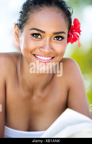 Portrait of beautiful smiling Balinese woman relaxing, she looking at camera Stock Photo