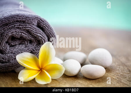 White frangipani on towel in the spa, close up Stock Photo