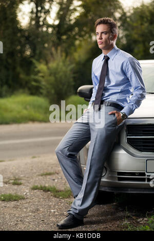 Portrait of a young handsome man, model of fashion next car Stock Photo