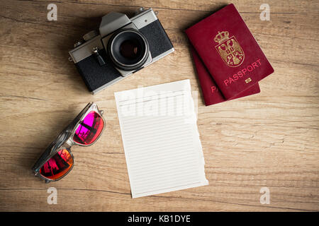 Empty paper with travel things for traveling on wooden background Stock Photo