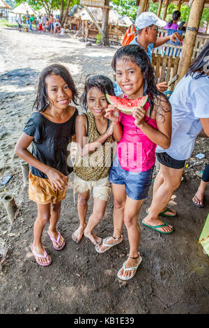 https://l450v.alamy.com/450v/kb1e39/three-young-filipino-girls-at-the-beach-eating-watermelon-in-ormoc-kb1e39.jpg