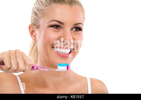 Beautiful smiling girl brushing healthy  teeth Stock Photo