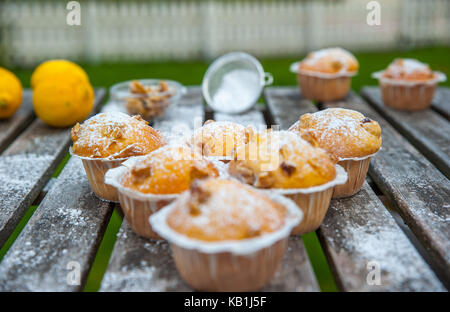 Homemade cupcakes with lemon on a wooden table Stock Photo
