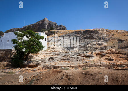 The remains of the amphitheatre in Lindos on the Greek island of Rhodes Stock Photo