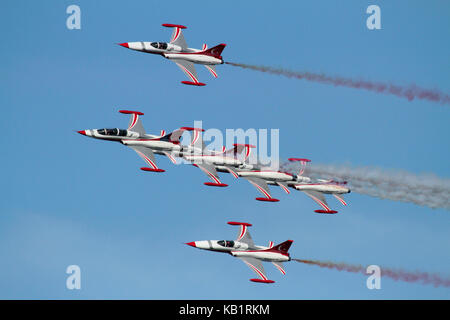 The Turkish Stars aerobatic display team flying their NF-5 combat jets in close formation Stock Photo