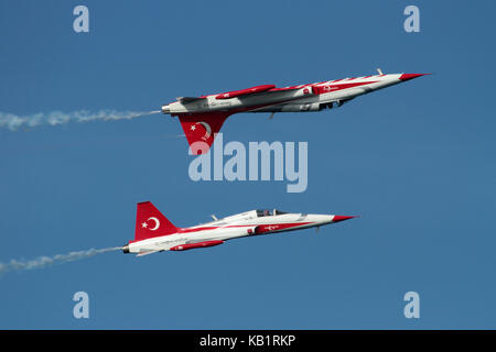 Two NF-5 jet fighters of the Turkish Stars display team (derivatives of the Northrop F-5A) during an airshow performance Stock Photo
