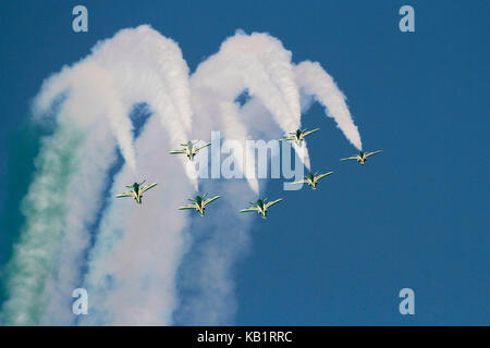 The Saudi Hawks aerobatic display team of the Royal Saudi Air Force performing a formation loop Stock Photo