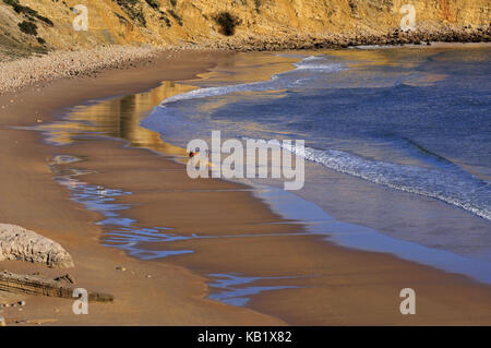 Portugal, Algarve, beach stroller in Praia da Mareta in Sagres, Stock Photo