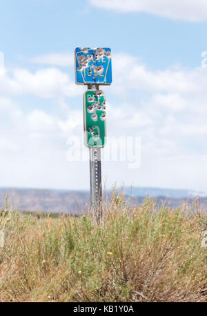 Signs with bullet holes, Grand Staircase - Escalante National Monument, Utah. Stock Photo