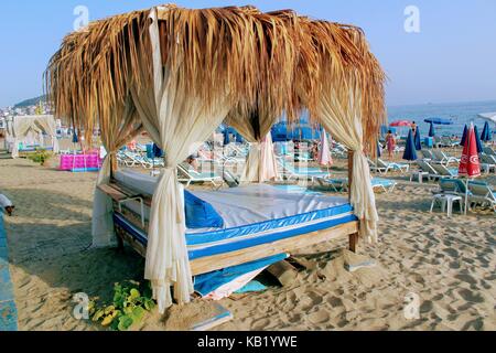July, 2017 - Bed with canopy on the beach in Alanya, Turkey. Stock Photo