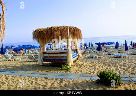 July, 2017 - Bed with canopy on the beach in Alanya, Turkey. Stock Photo