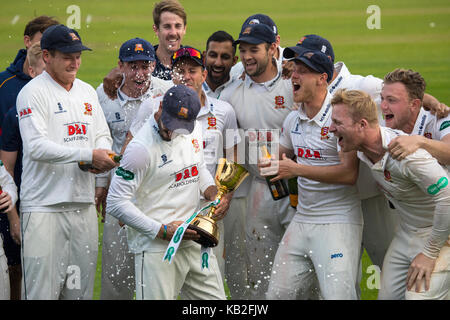 ESSEX, UK - SEPTEMBER 27TH 2017: Essex captain Ryan ten Doeschate and the team lift the Specsavers County Championship Division One Trophy at the Coun Stock Photo