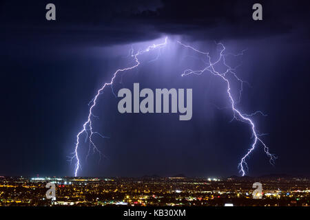 Intense thunderstorm lightning strike over the city in Phoenix, Arizona Stock Photo
