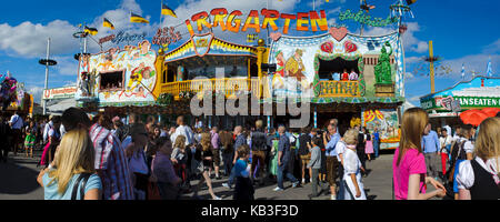 Oktoberfest in Munich, extreme panoramic photo of the guests and amusement rides, Stock Photo