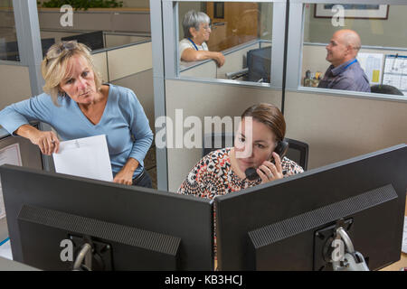 Executives in customer service center of electric power plant Stock Photo