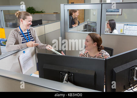 Female executives working in customer service center of electric power plant Stock Photo