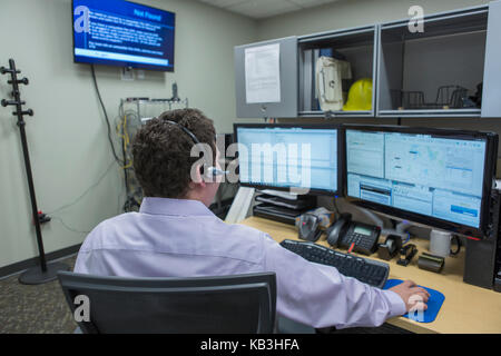 Male executive working customer service center of electric power plant Stock Photo