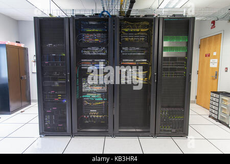 Racks of network equipment in communications room Stock Photo