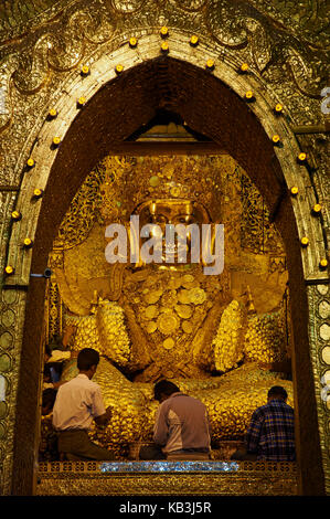 People in the golden Buddha, Paya Mahamuni, Myanmar, Asia, Stock Photo