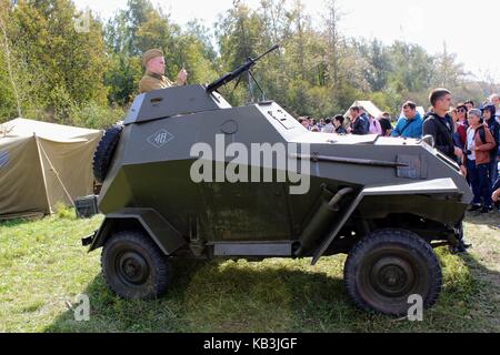 The International Military and Historical Festival 'Kulikovo Field': Red Army soldier on the tower of an armored personnel carrier. Stock Photo