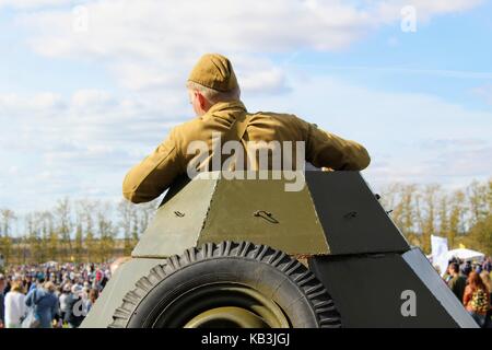 The International Military and Historical Festival 'Kulikovo Field': Red Army soldier on the tower of an armored personnel carrier. Stock Photo