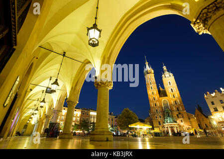 Nighttime view of the Church of Our Lady Assumed into Heaven, aka Saint Mary's Basilica, Krakow, Poland, Europe Stock Photo