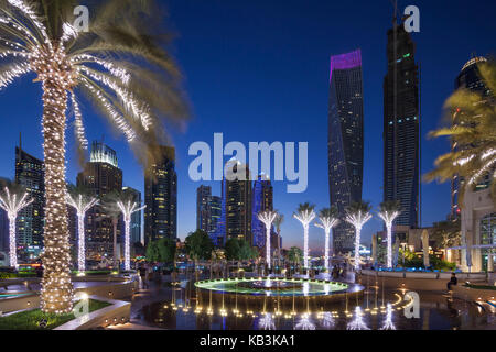 UAE, Dubai, Dubai Marina, high rise buildings including the twisted Cayan Tower, dusk Stock Photo