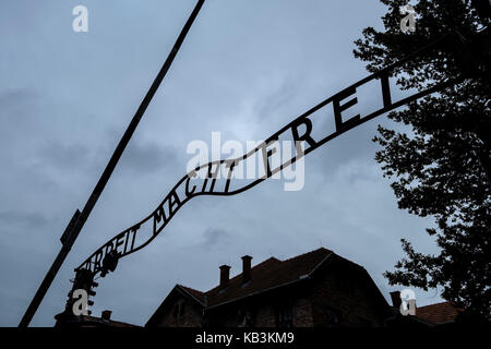 Arbeit Macht Frei sign at the entrance gate of Auschwitz WWII Nazi concentration camp, Poland Stock Photo
