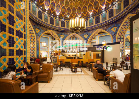 UAE, Dubai, Western Dubai, Ibn Battuta Mall, shopping mall built with six courts representing voayages by 14th century Arab explorer, Ibn Battuta, Persian Court with Starbucks coffee shop Stock Photo
