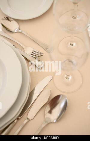 Plates and silverware on upscale restaurant table Stock Photo
