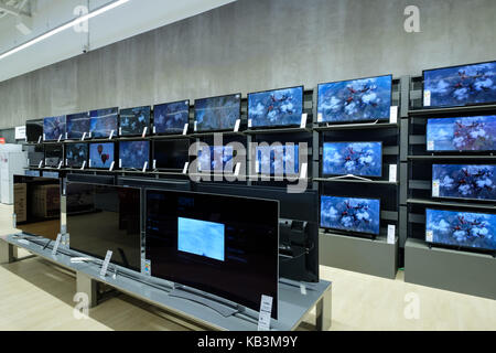 Flat screen televisions at an electronics store Stock Photo