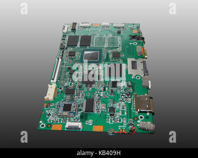 Motherboard tablet computer. Isolated on a gray background. Stock Photo