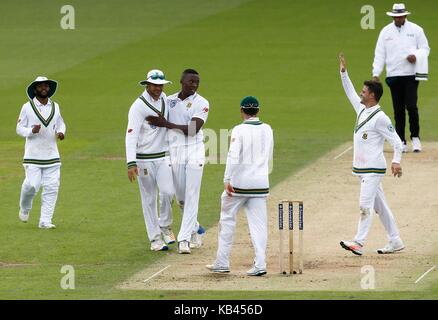 Kagiso Rabada of South Africa (3rd L) celebrates taking the wicket of Stuart Broad of England during day two of the third Investec Test match between England and South Africa at The Oval in London. 28 Jul 2017 Stock Photo