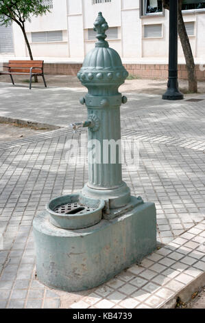 old drinking water tap in Spanish park area Stock Photo