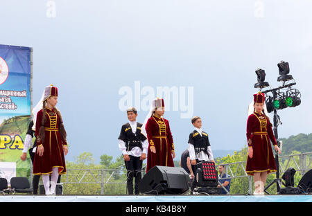 Adygea, Russia - August 19, 2017: Children's dance group in traditional Circassian clothes at the  open Adyghe cheese festival Stock Photo