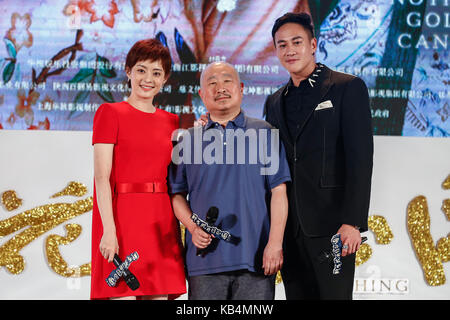 From left) Chinese actor Sun Honglei, actress Zhou Dongyu and actor Dong  Zijian attend a press conference for their movie The Ark of Mr. Chow in  Sh Stock Photo - Alamy