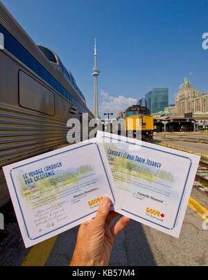 hand holds Train certificates Stock Photo