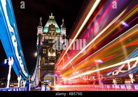 Tower Bridge in London, UK with moving red double-decker bus Stock Photo