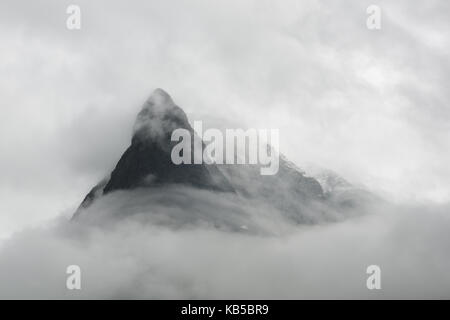 Mountain peak in fog in Innerdalen Stock Photo