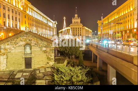 Night view in the center of Sofia church of St Petka, Council of Ministers, National Assembly and the presidency with Christmas decorations. Bulgaria Stock Photo