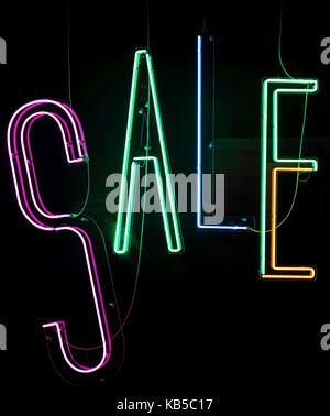 Neon Lights Sale Sign in Shop Window Stock Photo