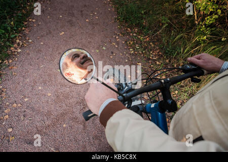 Senior man on cycle ride in countryside Stock Photo