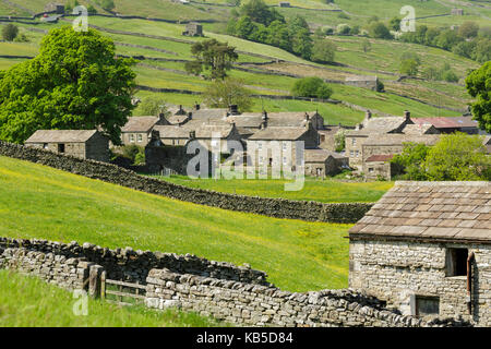 Stone cottages at the remote village of Thwaite in upper Swaledale, The Yorkshire Dales, Yorkshire, England, United Kingdom Stock Photo